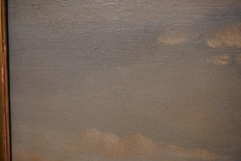 Close-up of painted canvas texture and fine surface wear in the sky portion of the composition