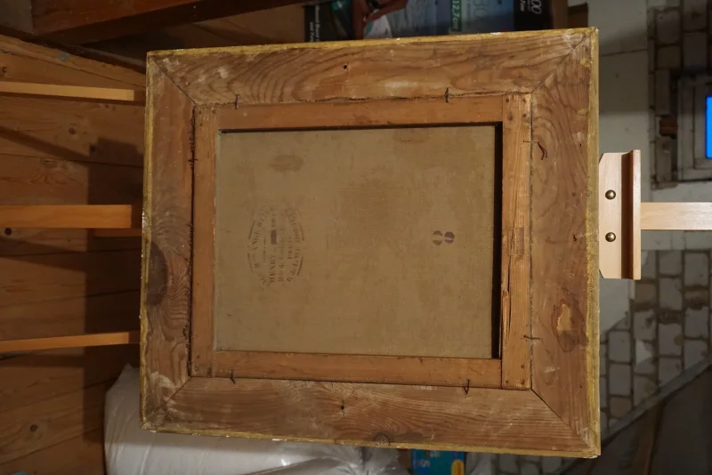 Back of the painting showing wooden stretcher bars, canvas reverse, chalk number and maker's stamp